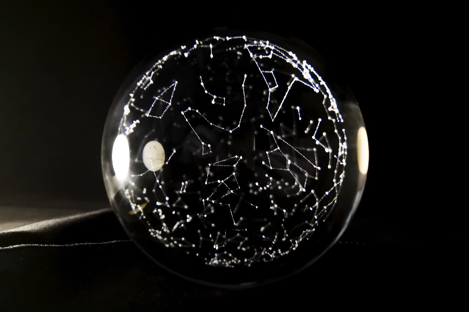 Glass orb packs all the constellations in the night sky into fancy desk ornament